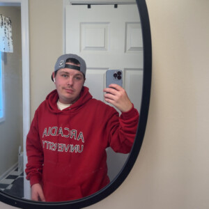 Patrick Poulson ’27 in an Arcadia hoodie.