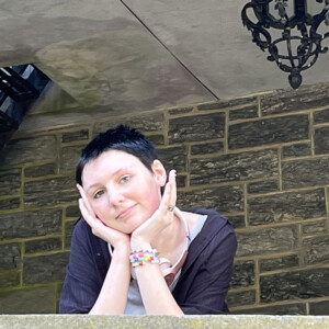 Ray Squibb ’29 leaning on a ledge of the Castle.