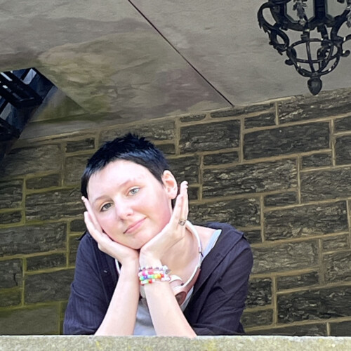 Ray Squibb ’29 leaning on a ledge of the Castle.