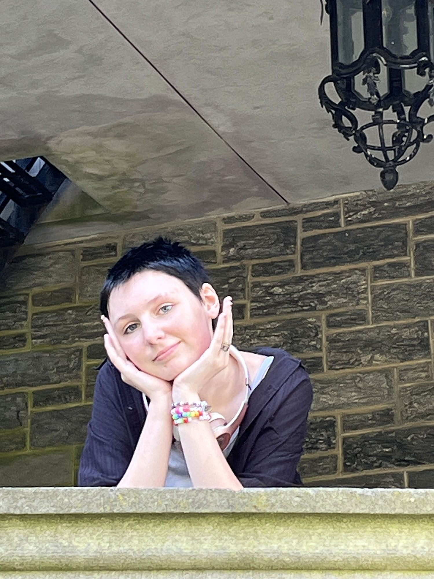 Ray Squibb ’29 leaning on a ledge of the Castle.