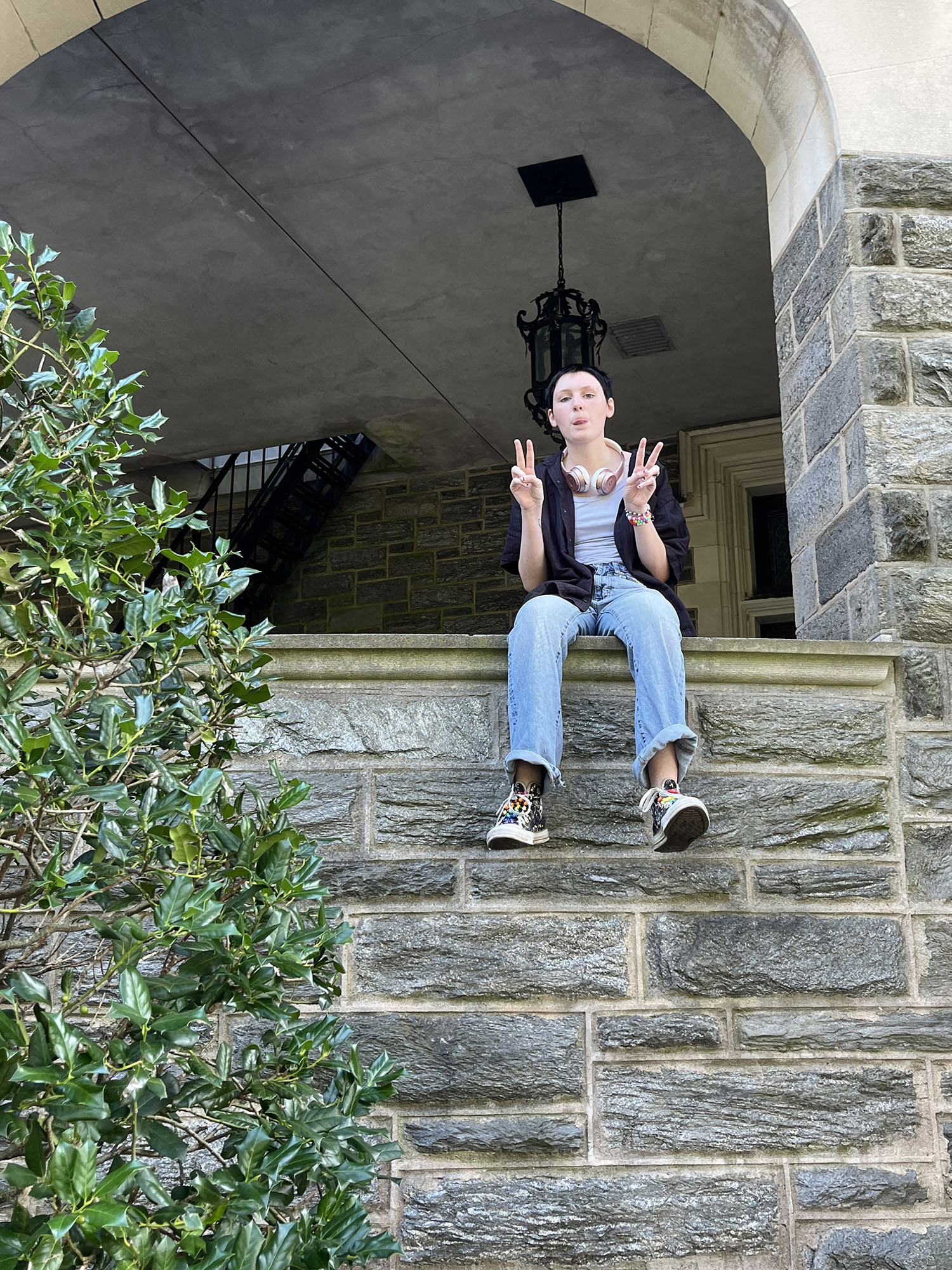 Ray Squibb ’29 sitting on a ledge of the Castle.
