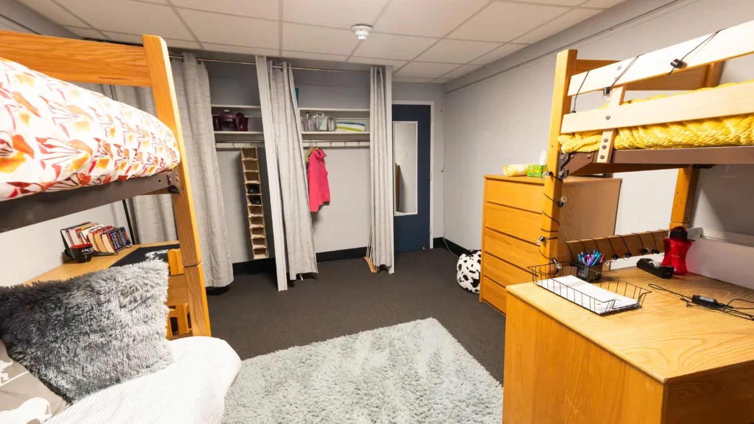 A look in one of the showrooms at Arcadia, where two bunkbeds are positioned on opposite sides of the room.