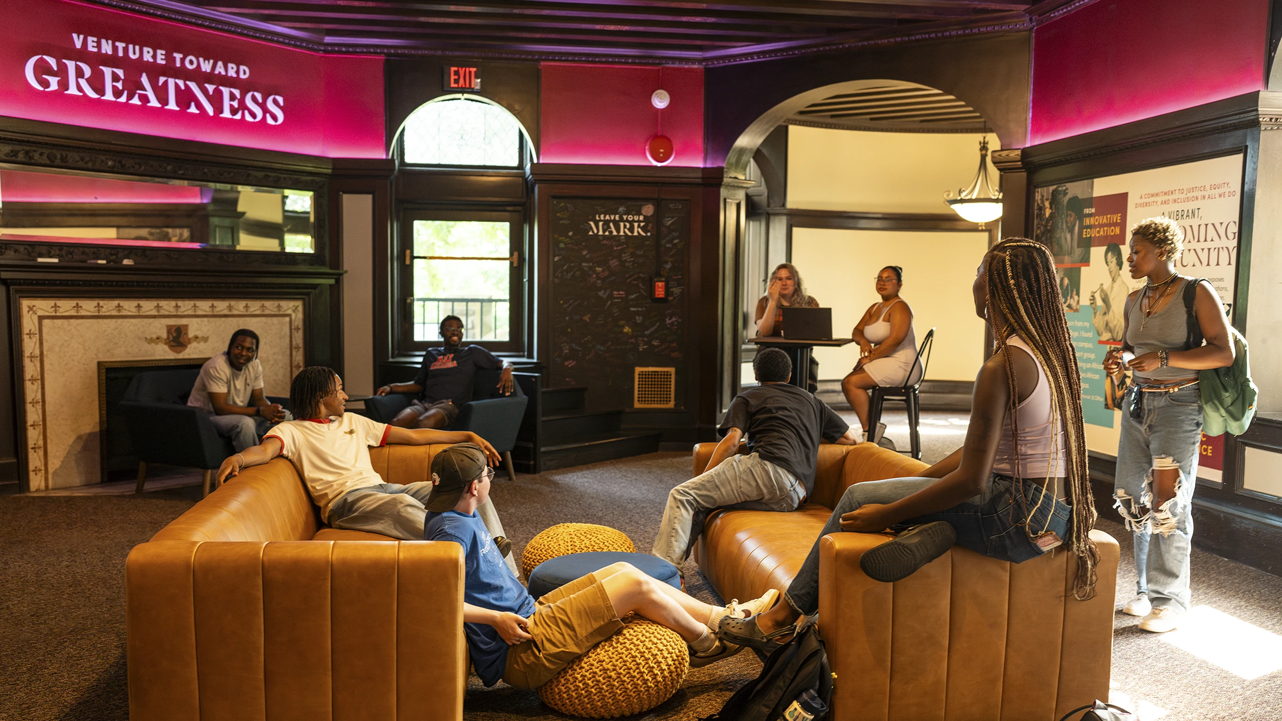 Students enjoy conversation in the alumni Office.