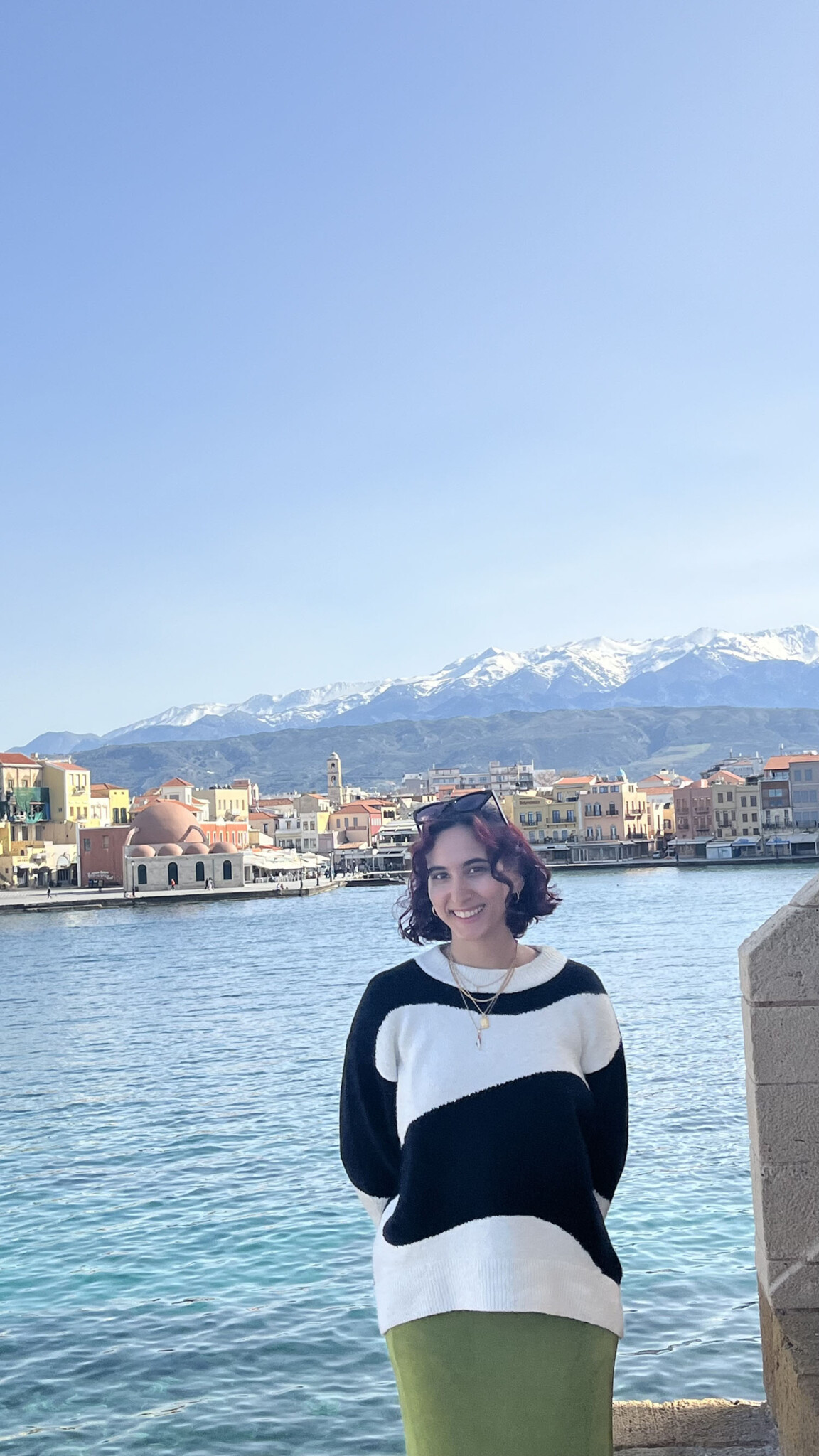 Briana Tavares ’26M standing in front of a lake.