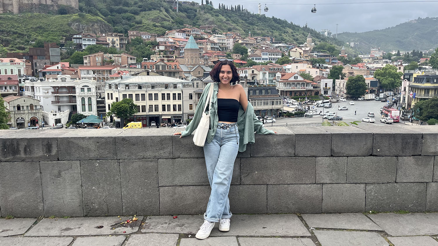 Briana Tavares ’26M leaning on a railing.