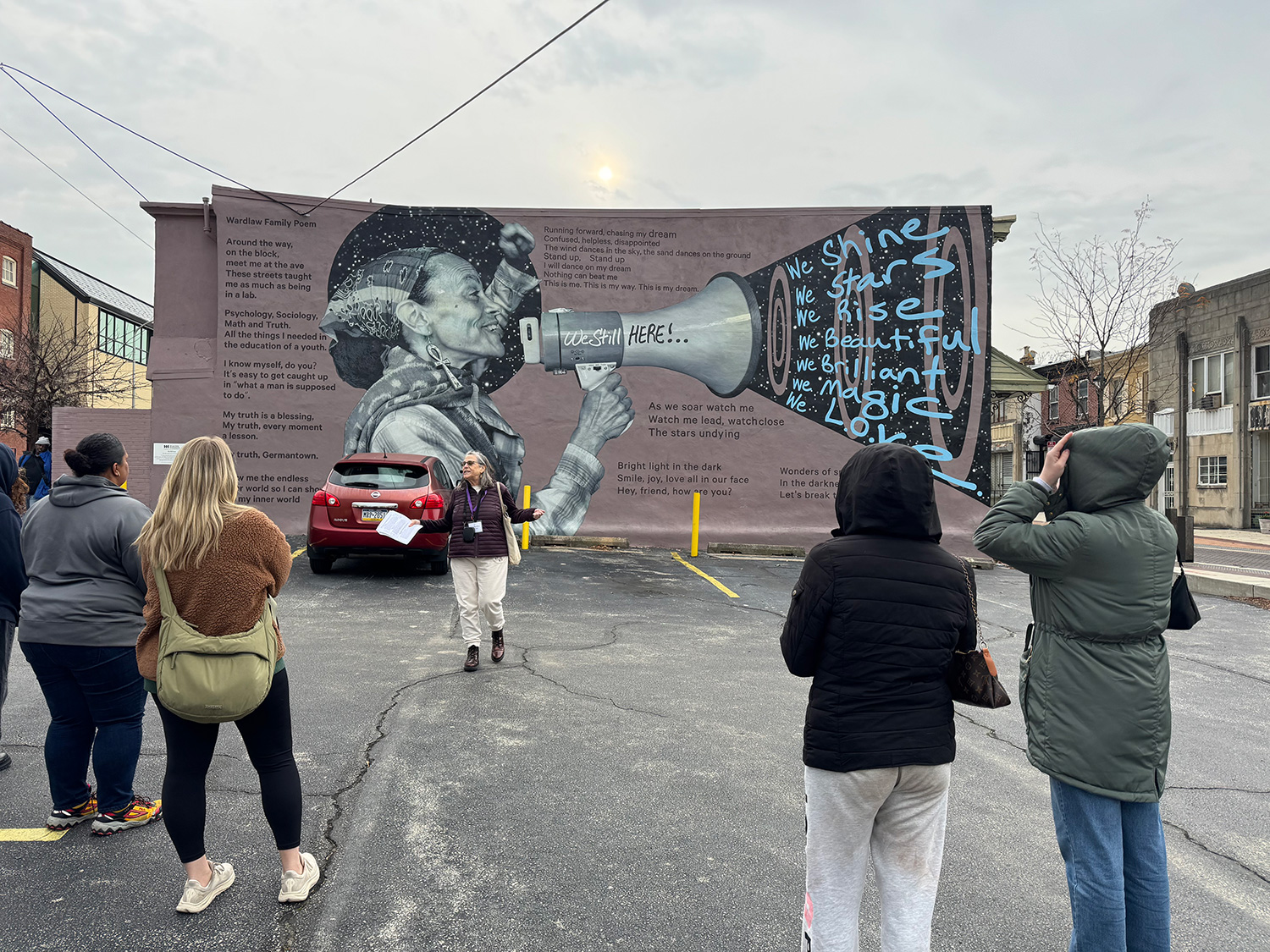 ED308 students looking at a mural in Germantown.
