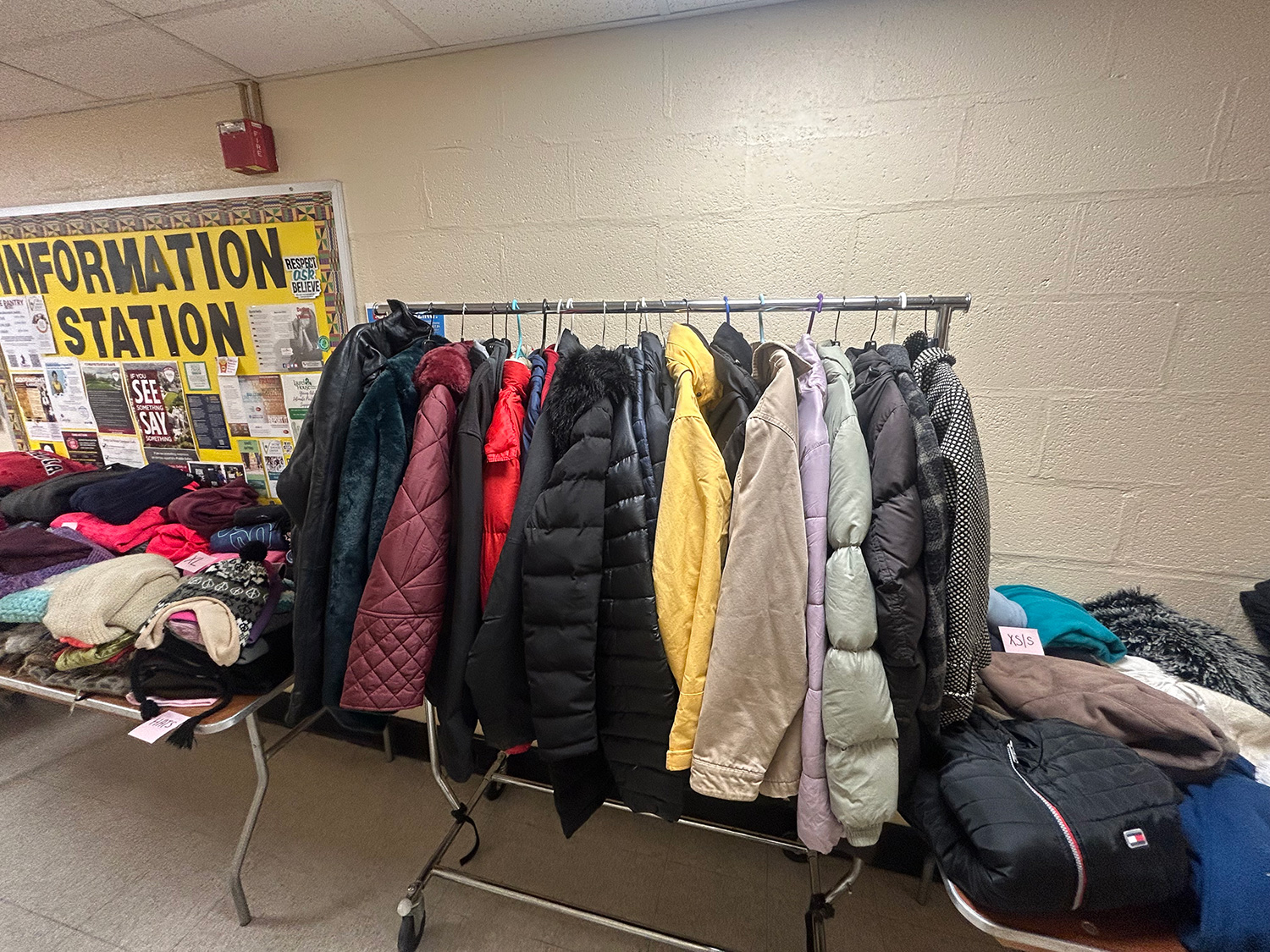 A coat rack at the Winter Coat and Essentials Drive pickup location.