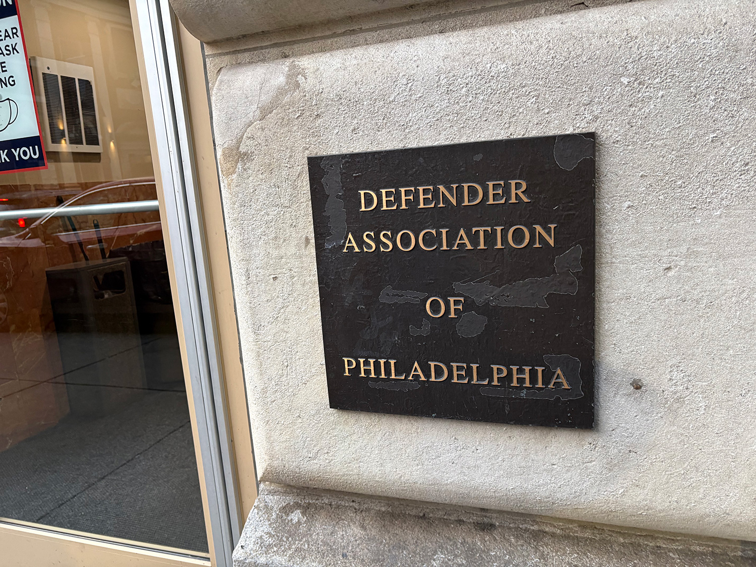 A plaque reading "Defender Association of Philadelphia".