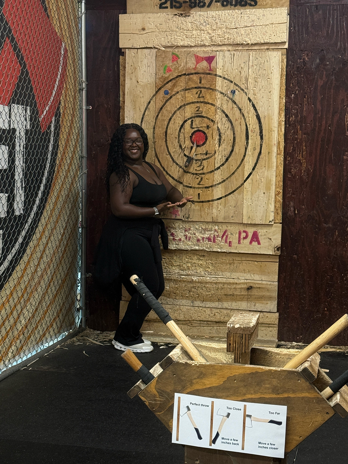 Jailynn Johnson ’26DPT showing an axe throwing bullseye.