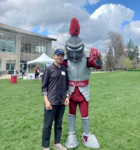 Chayhok Chhor ’27 with Archie the Knight.