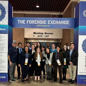 Forensic Science students taking a group photo at an international meeting.
