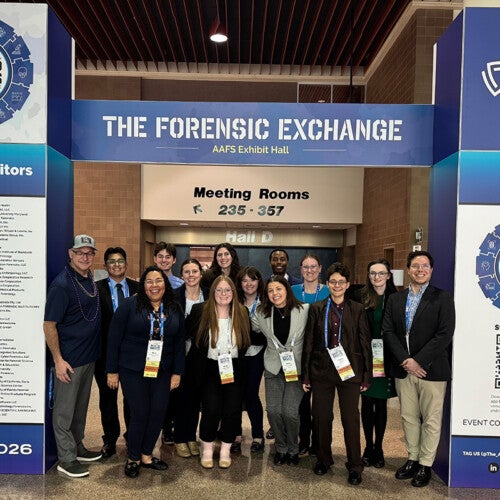 Forensic Science students taking a group photo at an international meeting.
