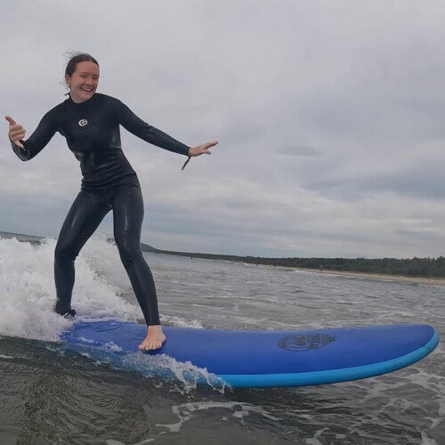 Callie Falzone ’26 surfing.