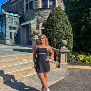 Abby Fuchs ’26 standing in front of Grey Towers Castle.