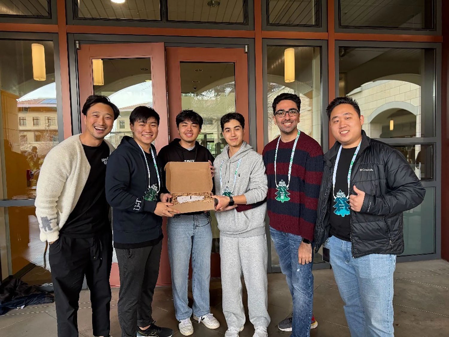 Ular Kimsanov ’27 and his team at the hackathon.