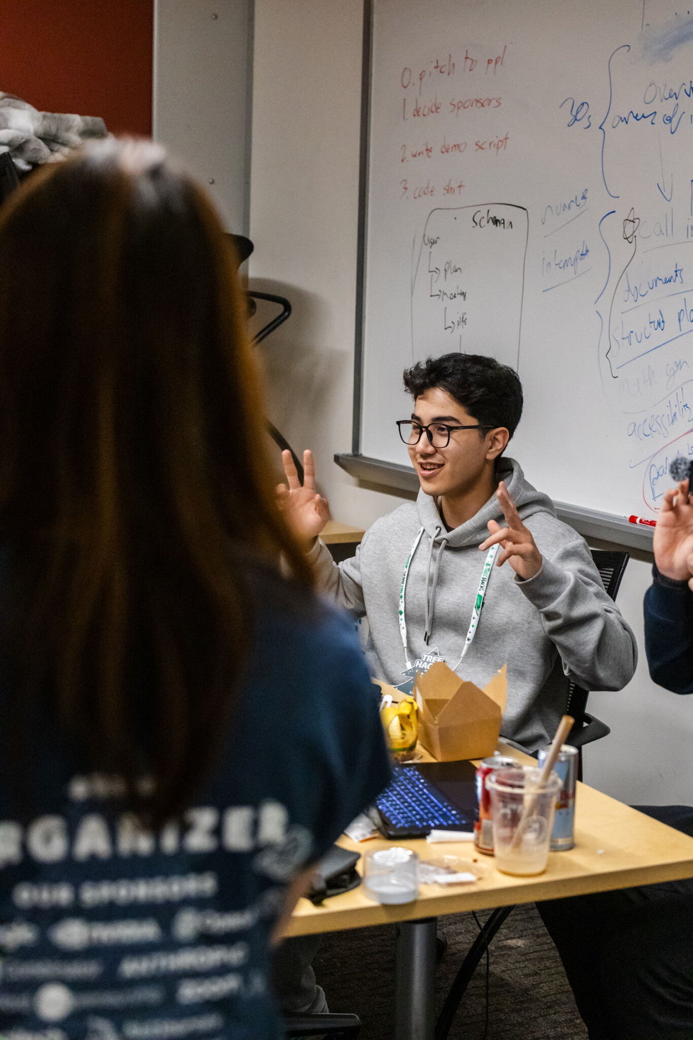 Ular Kimsanov ’27 talking at the hackathon.