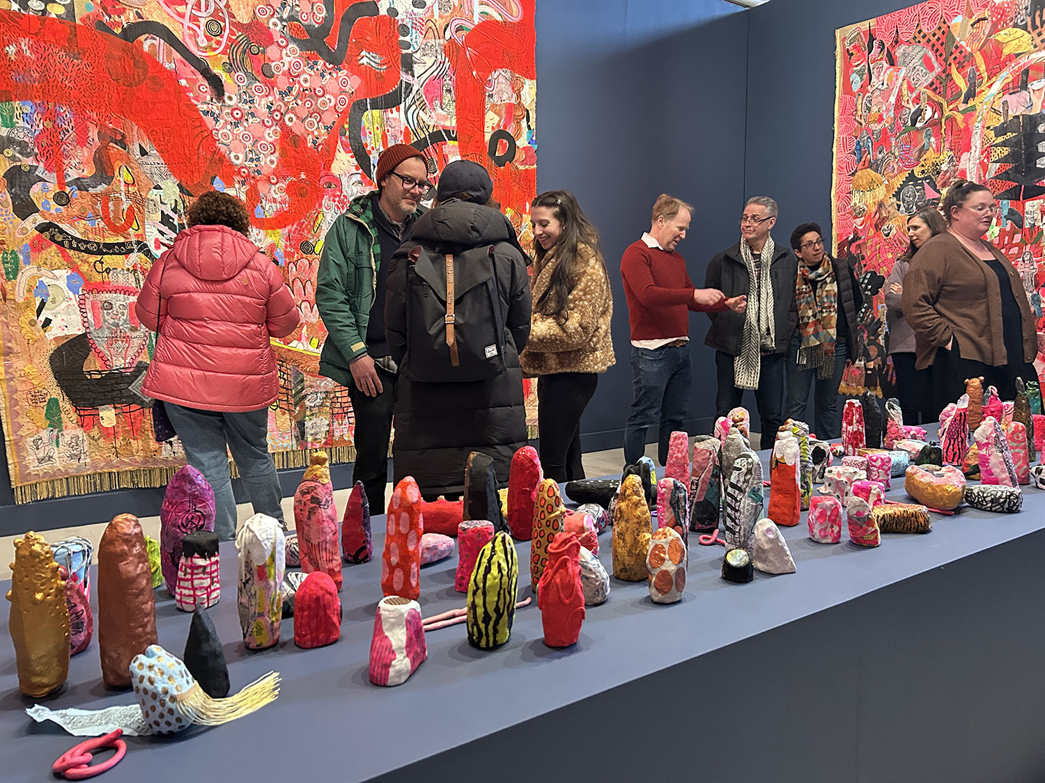 Guests interacting at the exhibition opening.