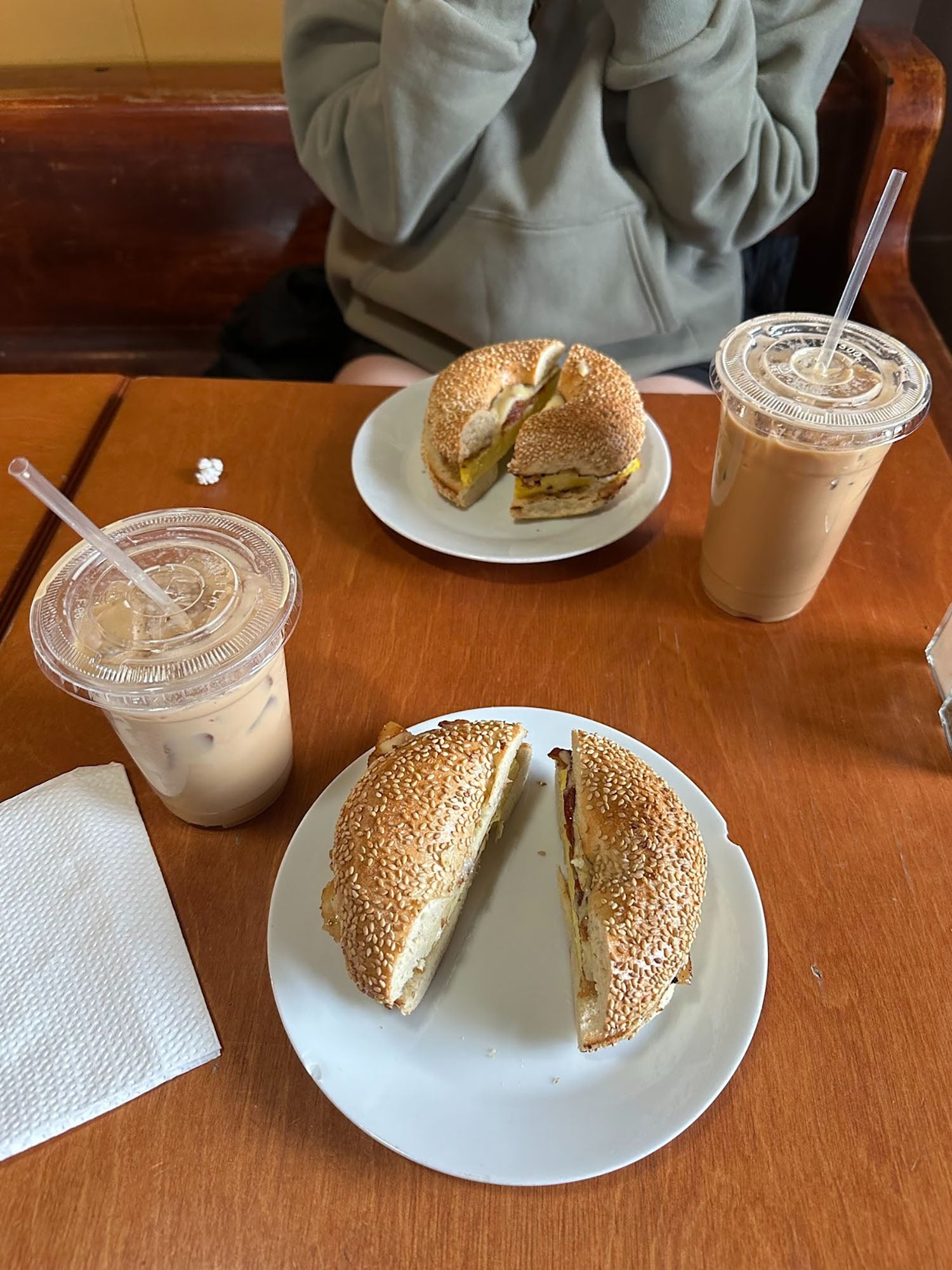 Callie Falzone ’26 and a friend's iced coffees and bagels.