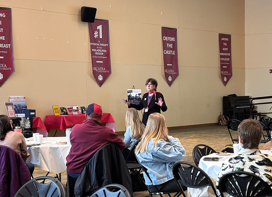 Barbara Simmons of The Peace Center standing in front of the audience during the non-violent peacekeeping workshop.
