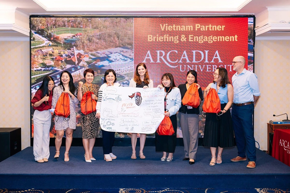Jessica Ketterlinus (center) and agent partners in Ho Chi Minh City Partner Engagement Event