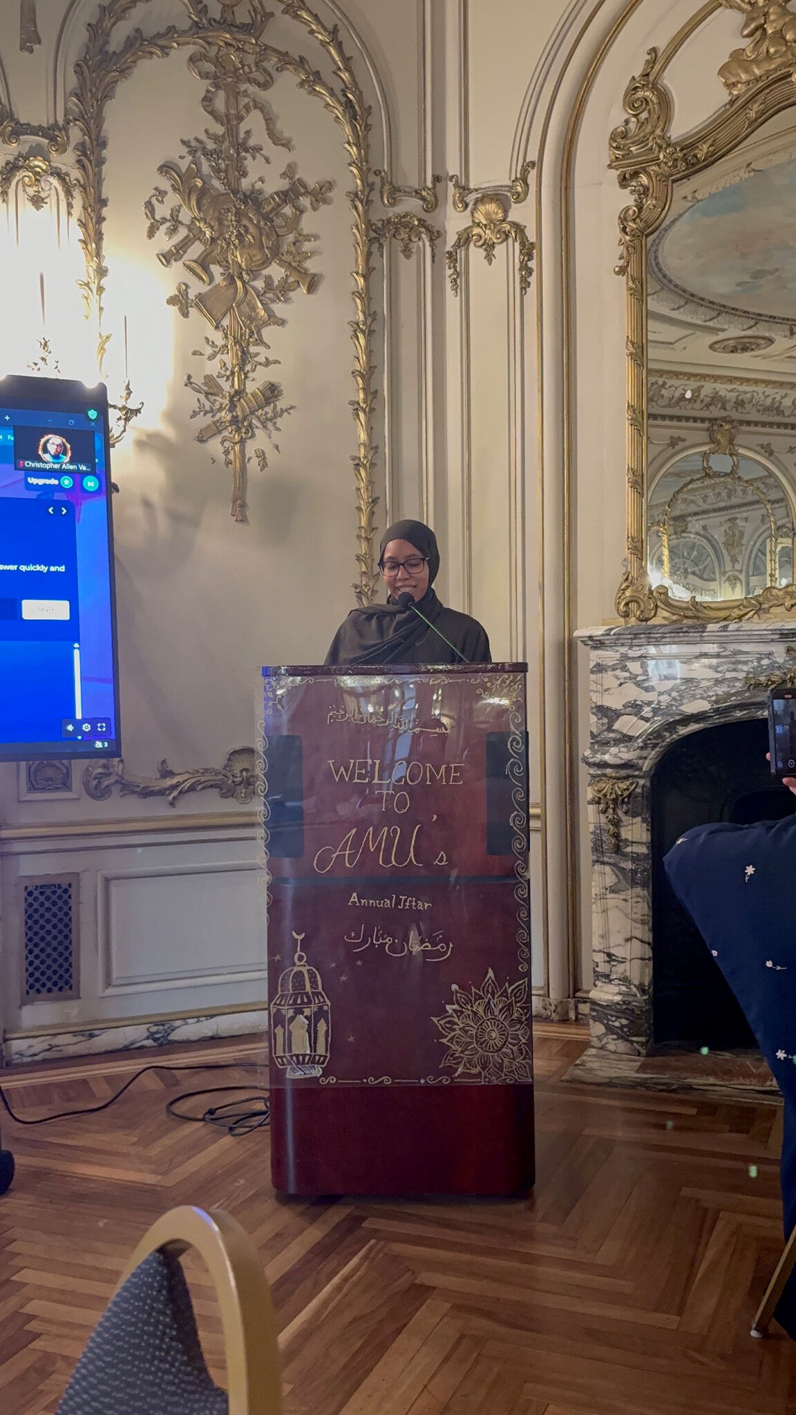 A speaker at the podium during AMU's Iftar.