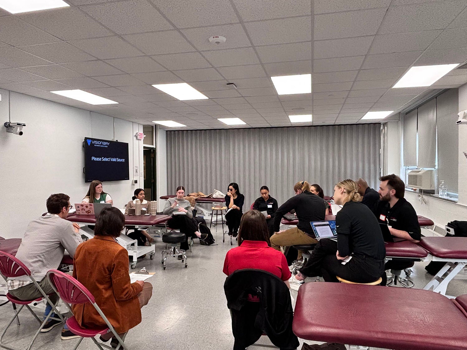 CHS students discussing case studies at the IPE event.