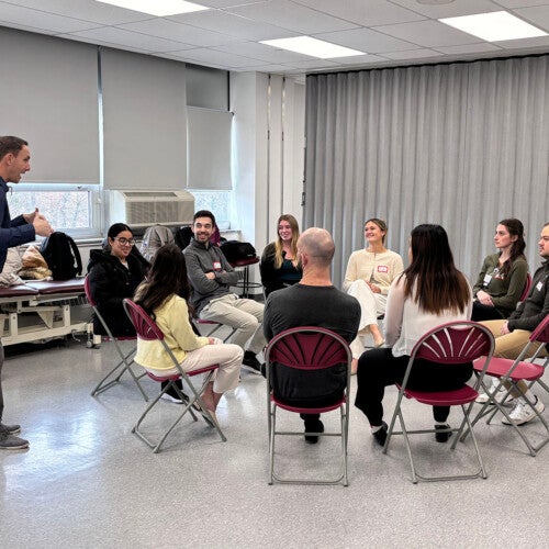 CHS students listening to Dr. Ryan Zarzycki while sitting in a circle.