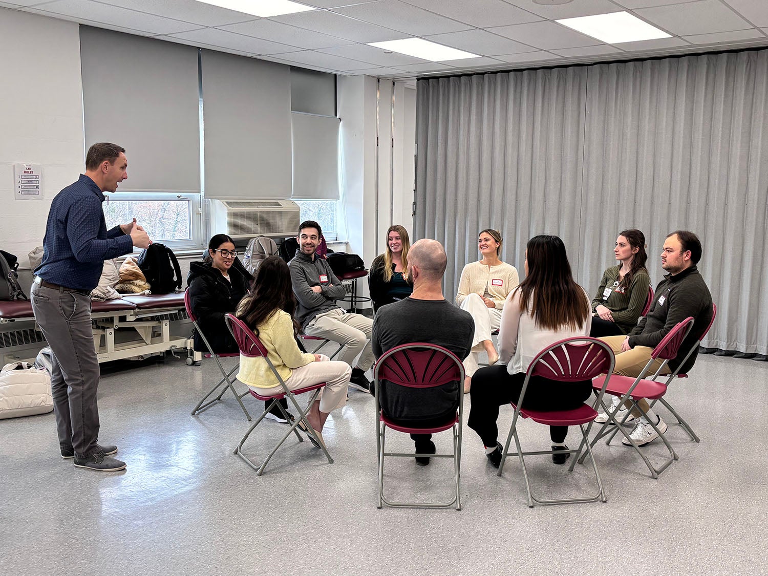 CHS students listening to Dr. Ryan Zarzycki while sitting in a circle.