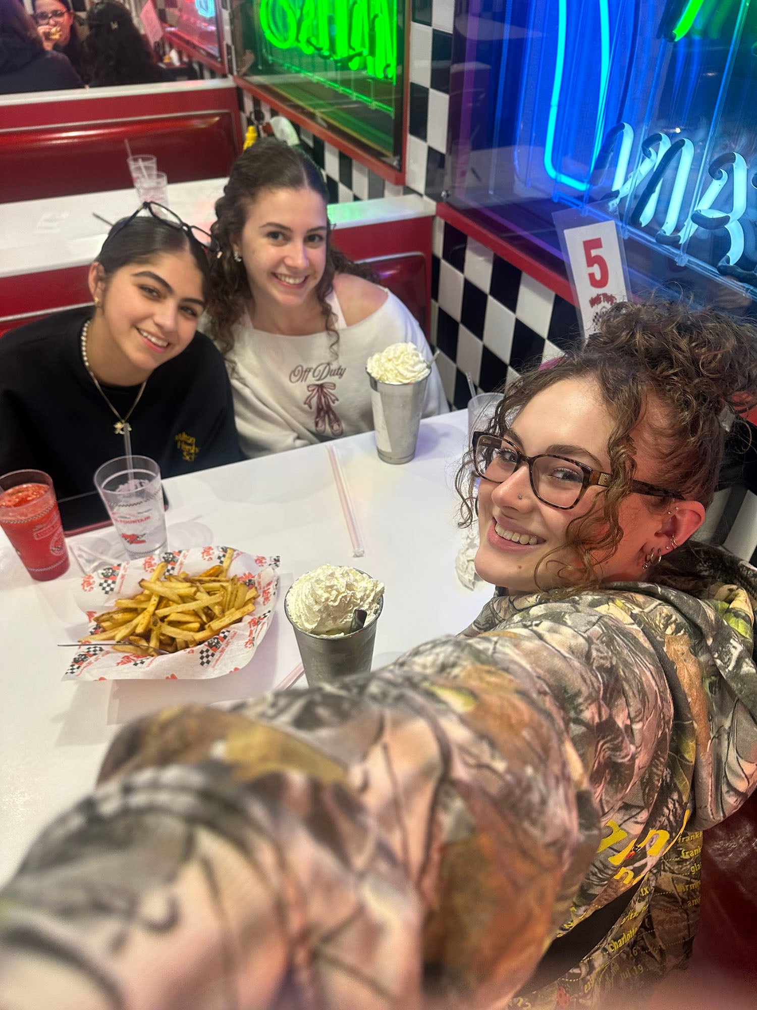 A group of Arcadia FTK students having dinner at Nifty Fifty's in Abington.