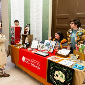 Gertie Smith ’27, Willow Edmonds ’26, and Lichen Balay ’25 staff the Arcadia Department of Art and Design table at last year's printPHILLY!