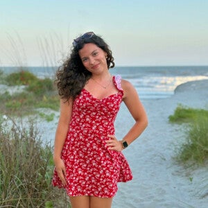Nora Zekkaria ’26 standing on the beach.