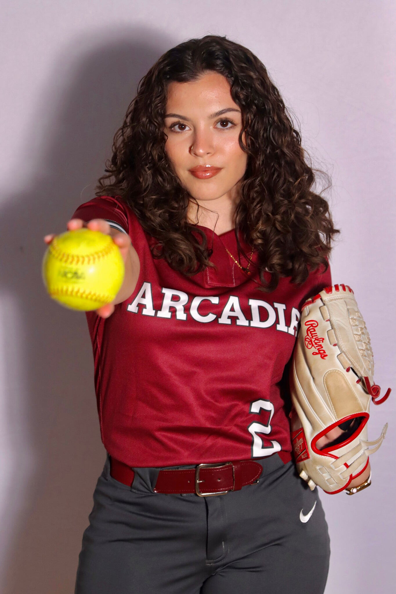 Nora Zekkaria ’26 in a softball uniform holding a ball.