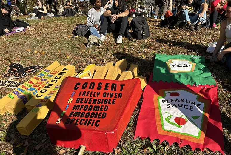 Event signs stretched across the green on campus.