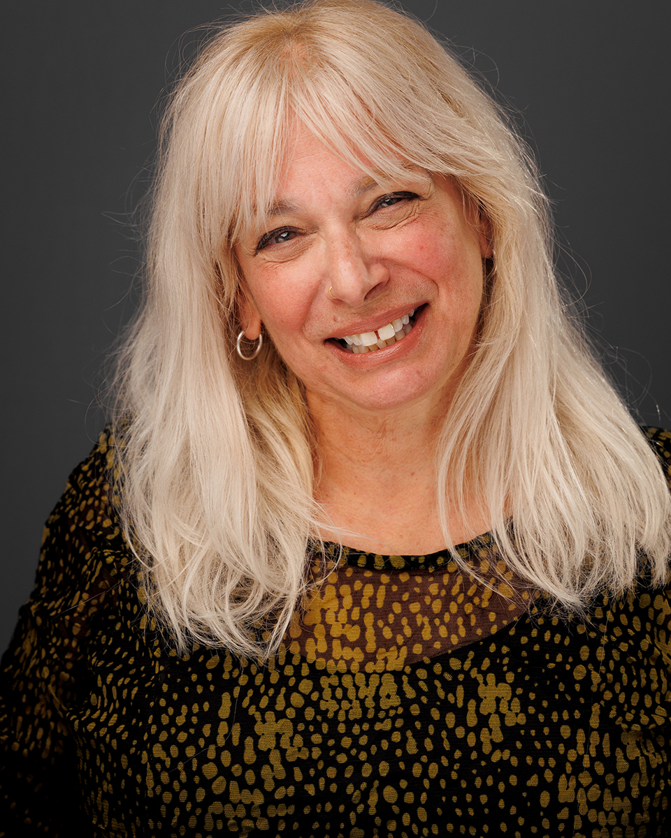 eleste Walker, actor, educator, and theatre director, smiling warmly.