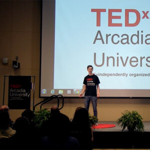 Seth Berkowitz, a 2019 Arcadia graduate, on stage at the 2019 TEDx Arcadia.