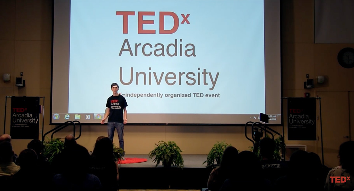 Seth Berkowitz, a 2019 Arcadia graduate, on stage at the 2019 TEDx Arcadia.