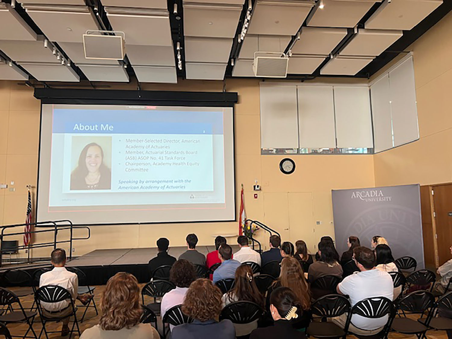 Attendees watching the Philadelphia Actuaries Club presentation in the Great Room.