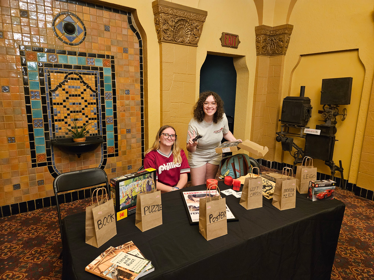 Students setting up a raffle table at the Ambler Theater.