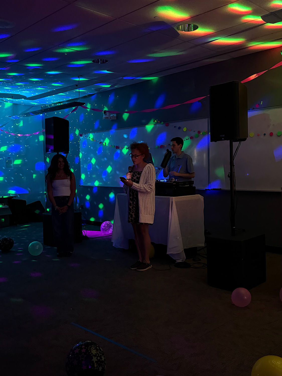 Students addressing their peers at ArcadiaFTK's Dance All Knight.