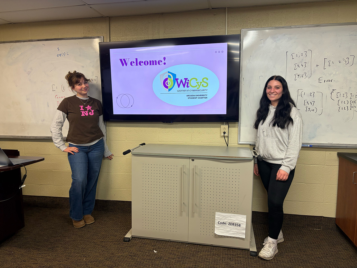 Sabrina Barrile ’26 (right) at a WiCyS meeting.