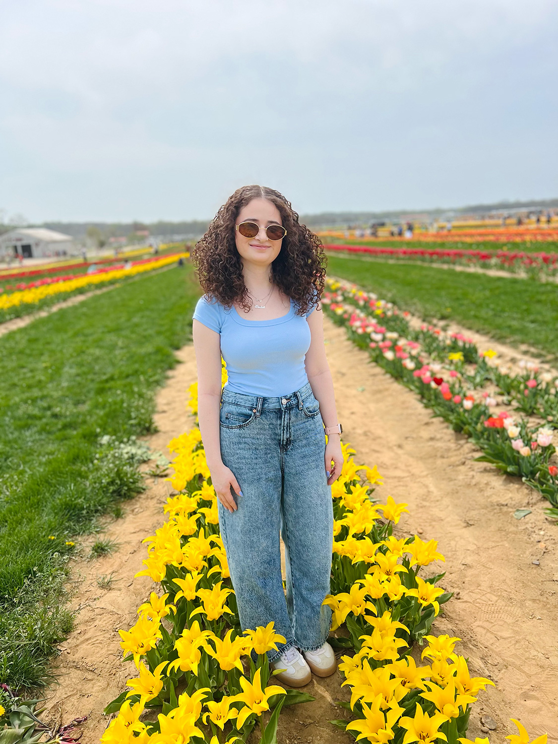 Erika Korenblit ’23, ’26M in a field of flowers.