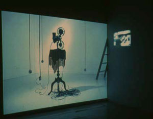 Photo of a video projector facing a role.