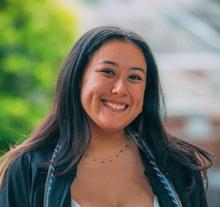 Honors Convocation 2026 award recipient Cecilia Ramirez stands outside and smiles.