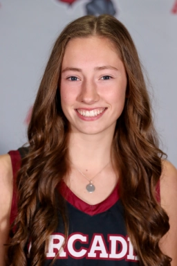 Honors Convocation 2026 award recipient Delaney Leigh Bell smiles in her Arcadia University tank top jersey.