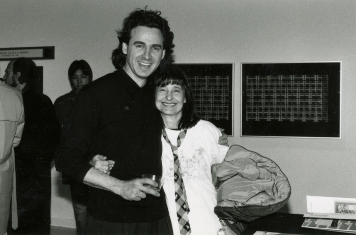 Black and white photo of two people hugging