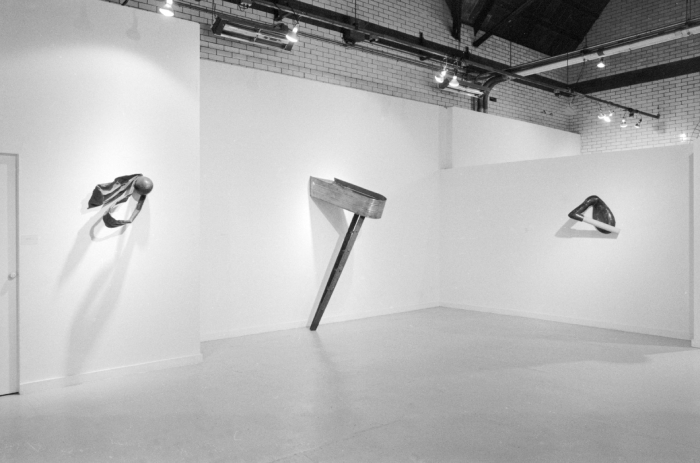 Photo of a white room with three metal sculptures
