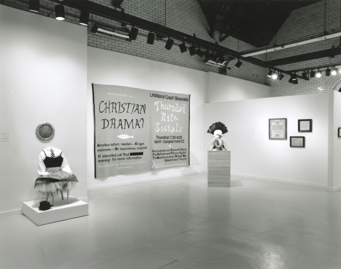 Black and white photo of an exhibit with statues.