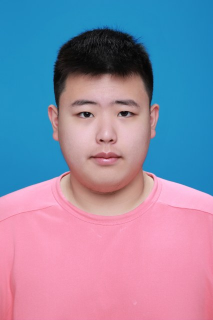Honors Convocation 2026 award recipient Tian Yu Xu stands in front of a blue background and smiles slightly.