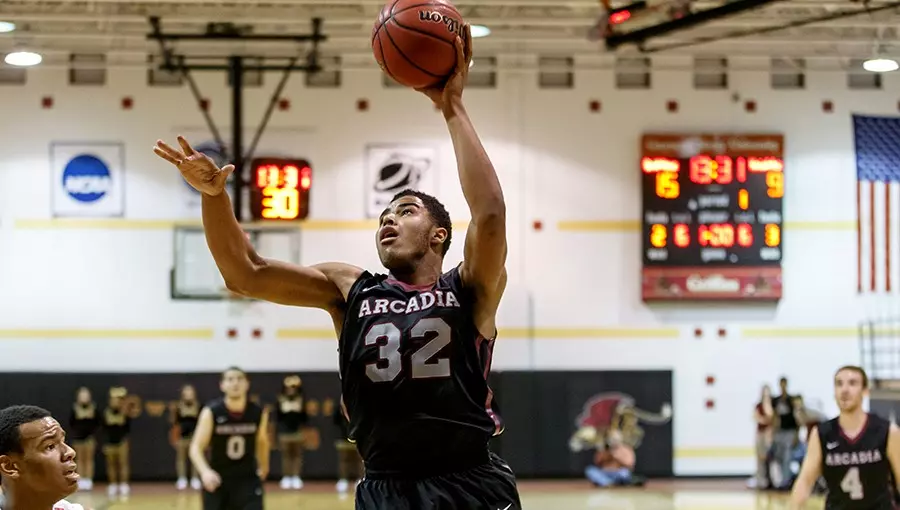 Darren James II ’20, ’26MBA playing basketball.