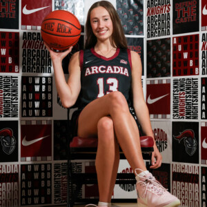 Delaney Bell ’26 holding a basketball.